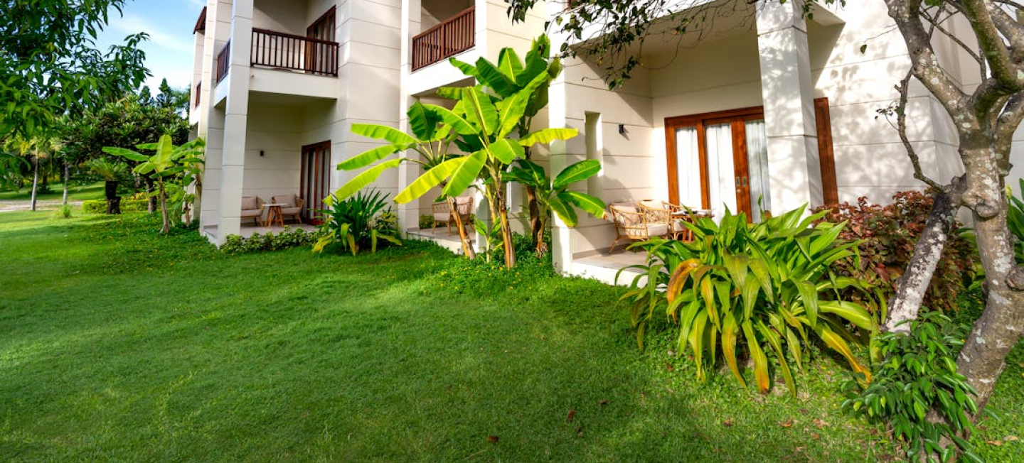 A freshly cut lawn at an extravagant house