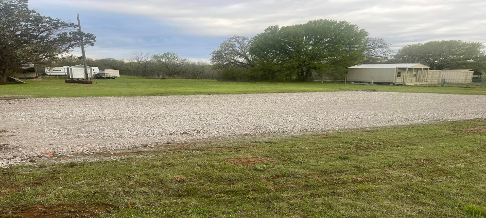 A freshly paved plot of land made for a driveway
