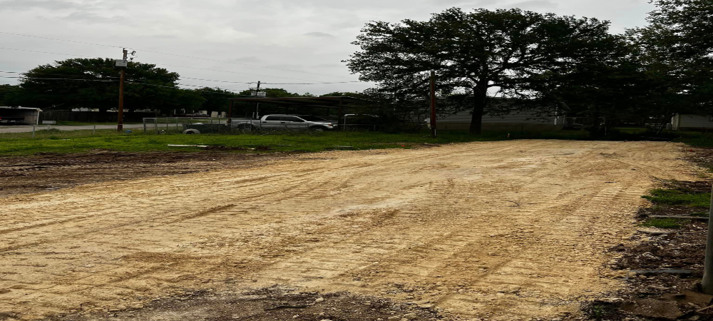 A dirt road paved down for a new driveway